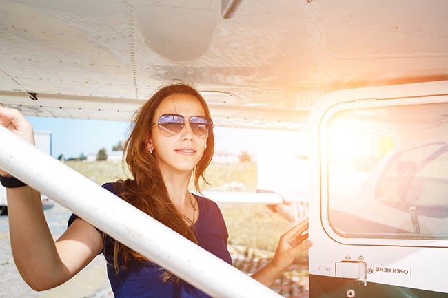Woman by Plane