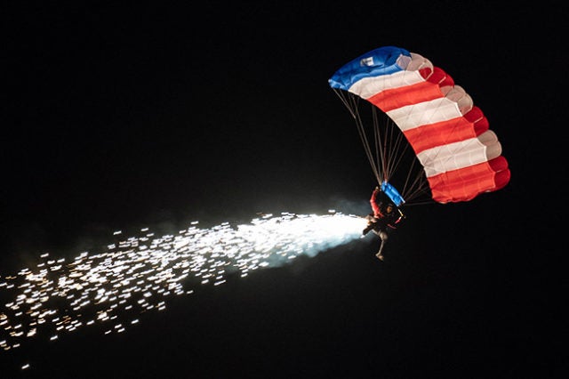 Parachuting flag display.