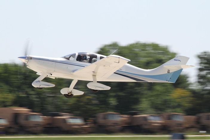 A Wheeler Express composite kit plane taking off at Oshkosh.