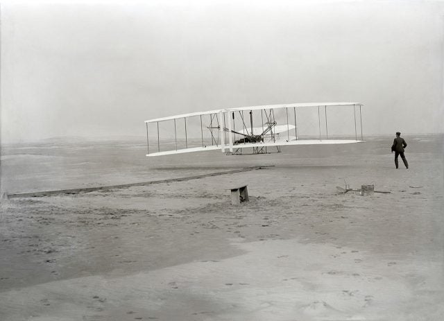 The Wright Flyer on its first flight.