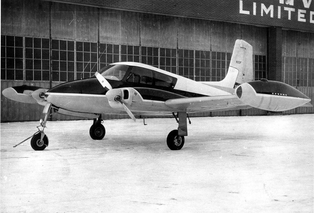 A vintage straight-tail Cessna 310 similar to N1812H.