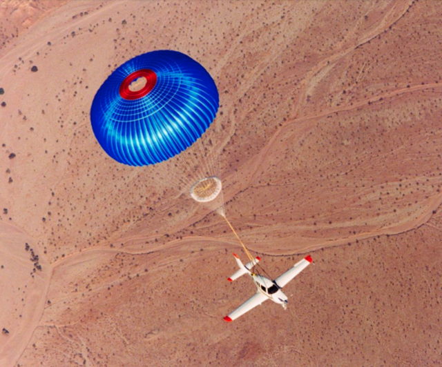 Photo of a Cirrus SR-series single under chute. Courtesy, Cirrus Aircraft.