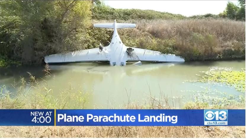 A screen capture from CBS Sacremento's coverage of a Cirrus that went down in California under its CAPS whole-airplane recovery parachute.