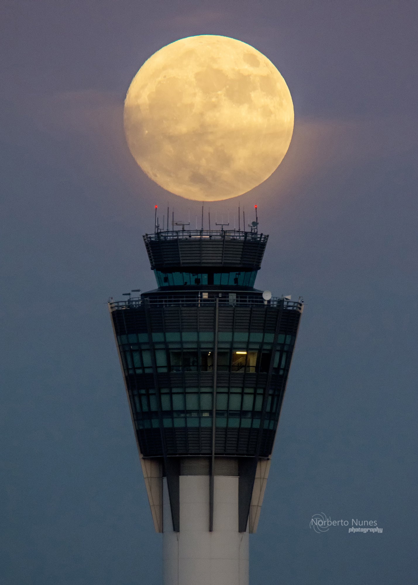 Norberto Nunes captured this shot of the supermoon of December, 3, 2017, by using an app to carefully plan the alignment. The clouds cooperated and cleared enough for the perfect shot, which Nunes captured just after sunset in the very small window of time he had to get the shot.