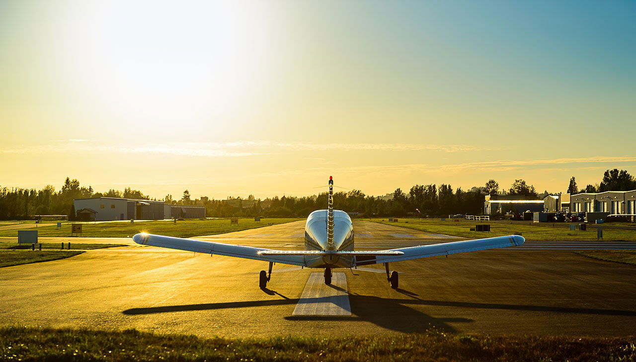 Small airplane at sunset