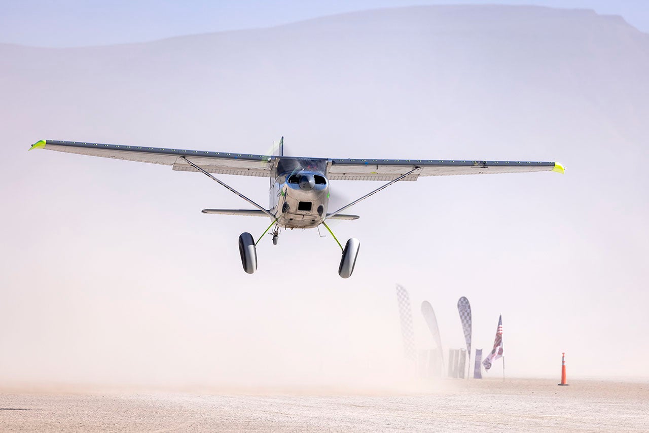 A Cessna 180 makes a low pass during the tenth High Sierra Fly-In. Photo by Jim Raeder
