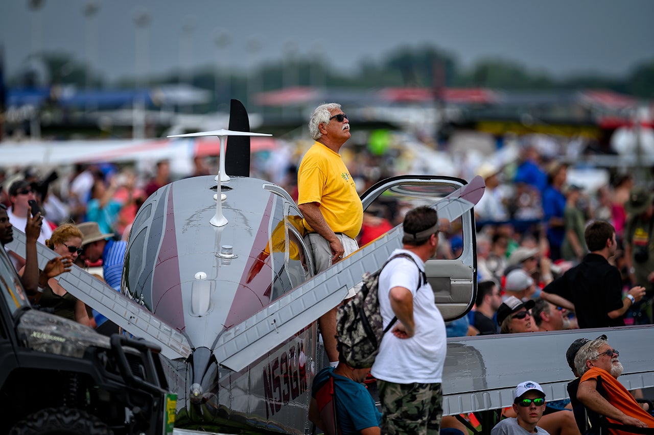 V-35 Bonanza surrounded by airshow spectators