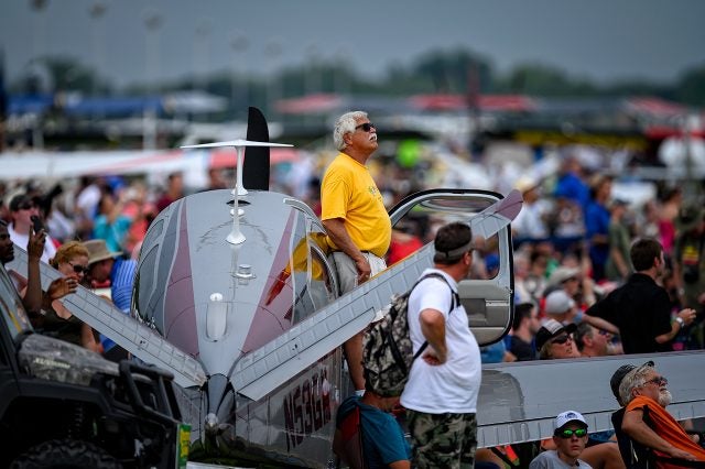 V-35 Bonanza surrounded by airshow spectators