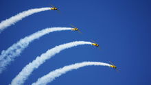 North American T-6 Texans perform at EAA AirVenture Oshkosh. Photo by Cayla McLeod.
