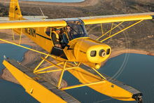 Cayla McLeod pilots a TopCub on floats. Photo by Jack Fleetwood.