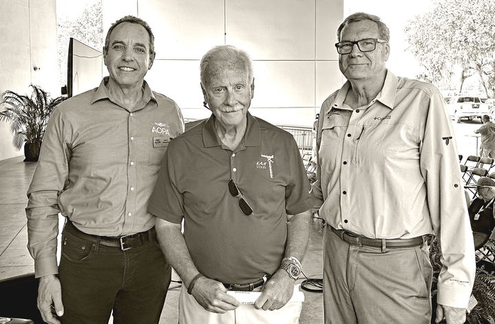 Darren Pleasance (from left), Jack Pelton, and Scott Severen pose after the MOSAIC presentation at Sun ’n Fun.