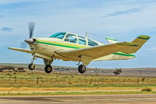 Beechcraft Bonanza taking off into a climb